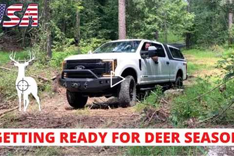 Moving and hanging deer stands and trail cameras