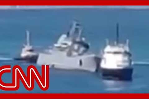 Video shows badly damaged Russian ship being towed to port